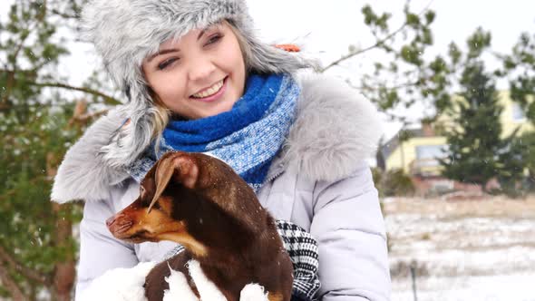 Woman with Dogs Outdoors in Winter