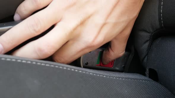 Disconecting booster seat from car bracket  slow-mo video