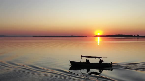 fishing boat on lake at sunset golyazi , bursa turkey  16