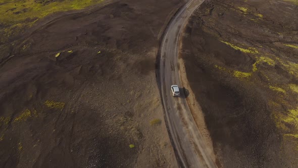 Car rides on a dirt road. Iceland landscape.