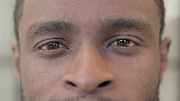 Close Up of Blinking Eyes of African Man