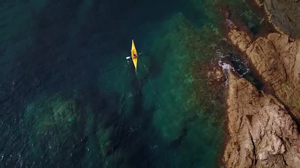 Flying above a kayak on turquoise water