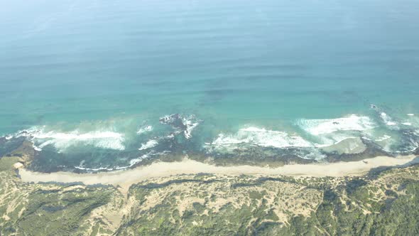 Waves Crashing on Coastline Beach Aerial Drone View