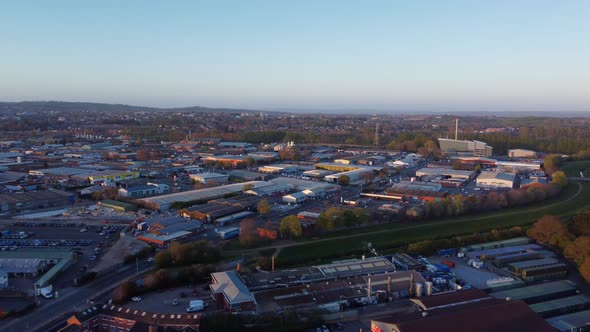 Aerial dolly during sunset and golden hour over Marsh Barton, showing Exeter Waste Recovery Facility