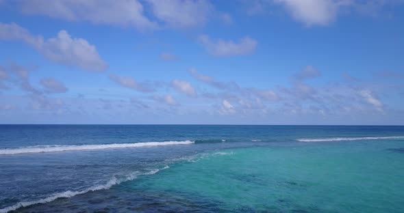 Wide angle aerial island view of a sunshine white sandy paradise beach and turquoise sea background 