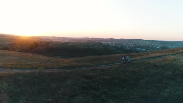 Couple Cycling Out of Town