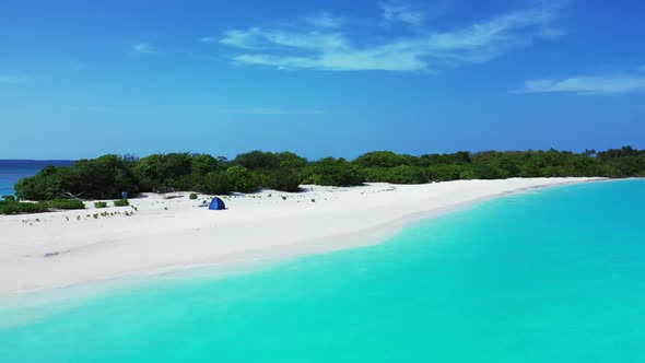 Aerial texture of beautiful island beach lifestyle by shallow sea and white sand background of a day