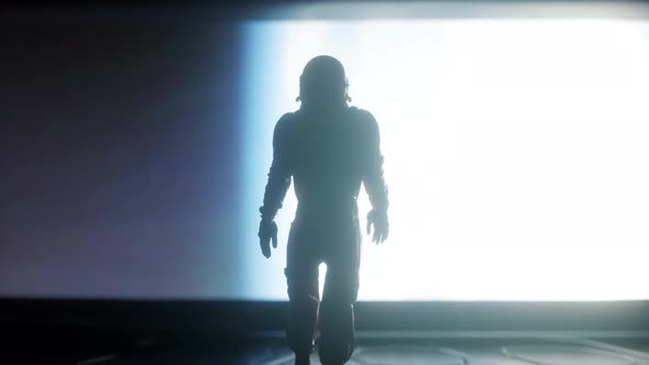 Following Shot of Astronaut in Space Suit Confidently Walking on Spaceship