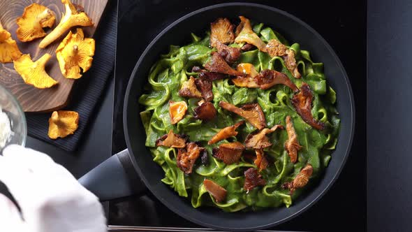 Sprinkling Pasta with Grated Cheese