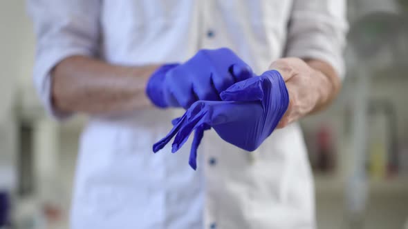 Closeup Unrecognizable Doctor Ripping Medical Gloves Indoors