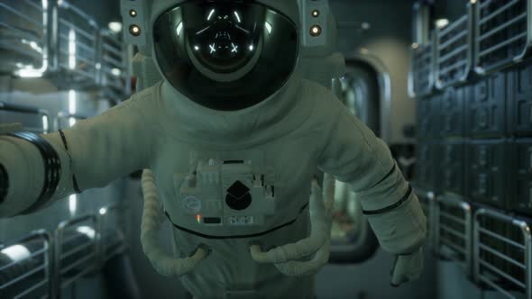 Astronaut Inside the Orbital Space Station alt