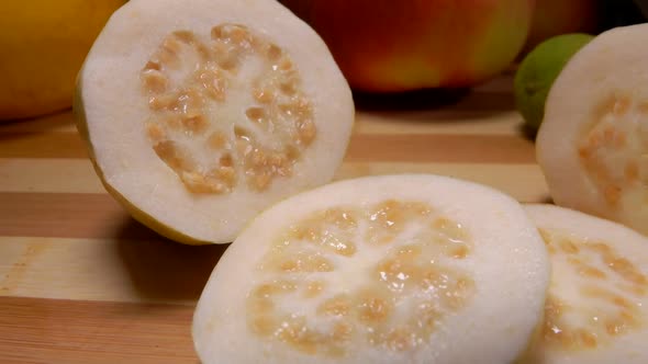 Exotic Guava Slices Are Lying on a Bamboo Board