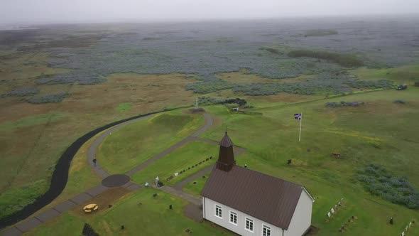 Strandarkirkja church in Iceland with drone video circling and up.