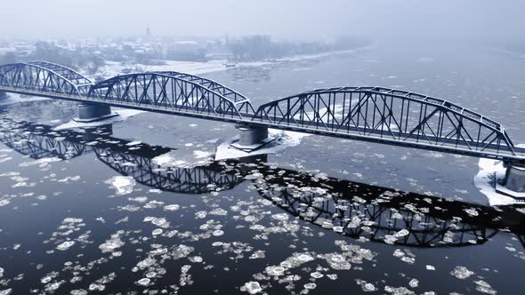 Aerial view of river with floe and bridge above, Bydgoszcz