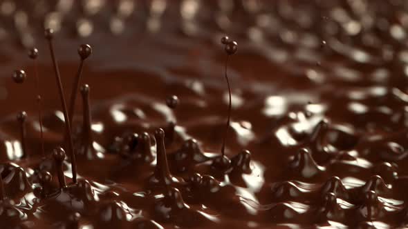 Super Slow Motion Shot of Splashing Melted Chocolate at 1000 Fps alt