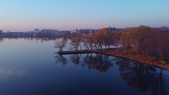 aerial peaceful sunrise over a lake