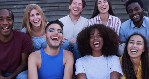 Young diverse people having fun outdoor laughing together - Diversity concept