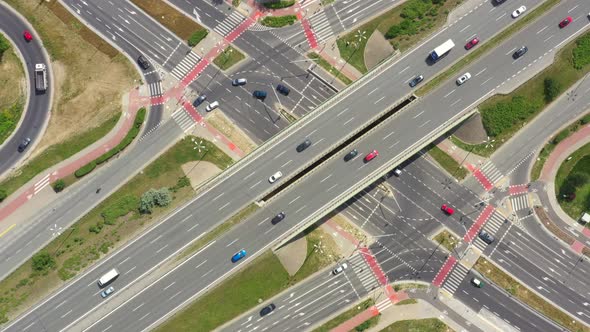 Highway aerial with cars and truck lorrying aerial view 4k. Four lane local road traffic transport v