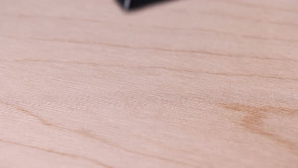 Man Puts Bar Code Print on Wooden Box, Made in China