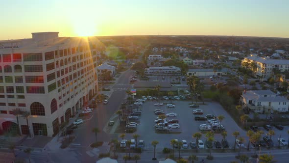 Flying toward residential area of Jacksonville Beach at sunset