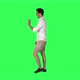 Young man walking and looking around the street, waving hello, over a green screen. 4K - VideoHive Item for Sale