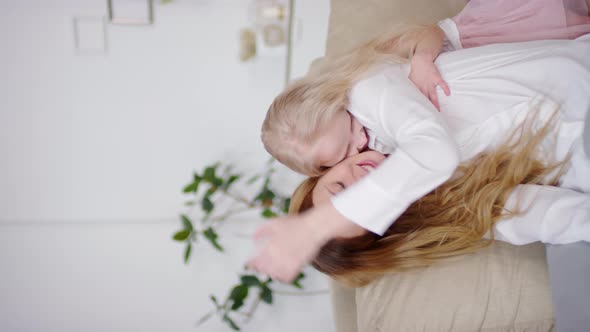 Vertical Video of Playful Little Girl and her Mother