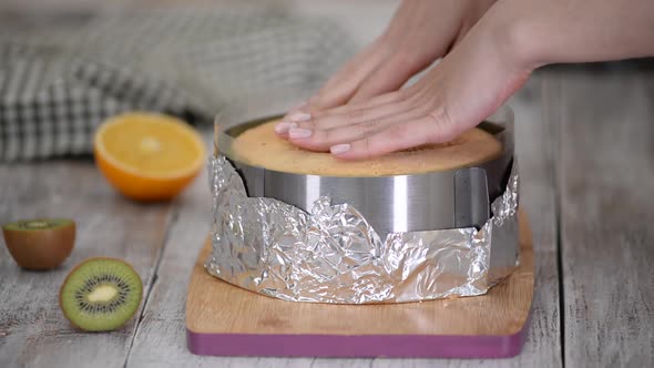 Girl Making Fruit Mousse Cake in the Kitchen