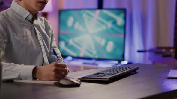 Office Employee Taking Notes and Doing Paperwork Report