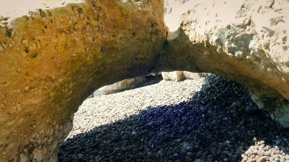 Natural Arch In Beach Rocks