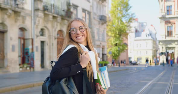 Modern Woman in Trendy Clothes and Glasses Enjoying Her Walk in the City