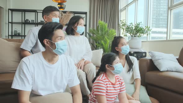 asian family multi generation wearing surgical facial mask stay quarantine together in quarantine