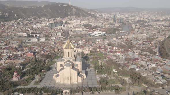 Aerial view of Holy Trinity Cathedral Sameba in Tbilisi Georgia. Sunrise drone footage 2021