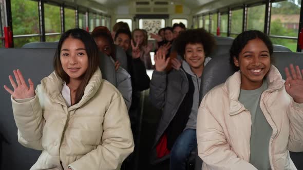 Cheerful Multinational Pupils Posing on School Bus