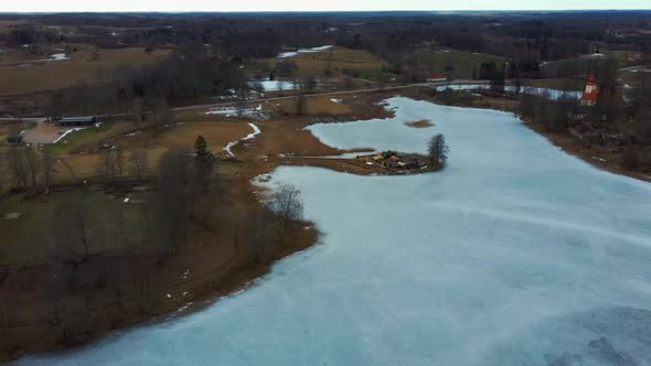 Araisi Lake Castle in Latvia Aerial Shot From Above. Historical Wooden Buildings on Small Island in