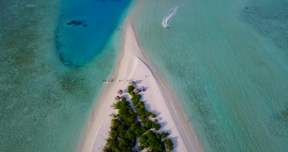 Daytime drone travel shot of a paradise sunny white sand beach and aqua turquoise water background i