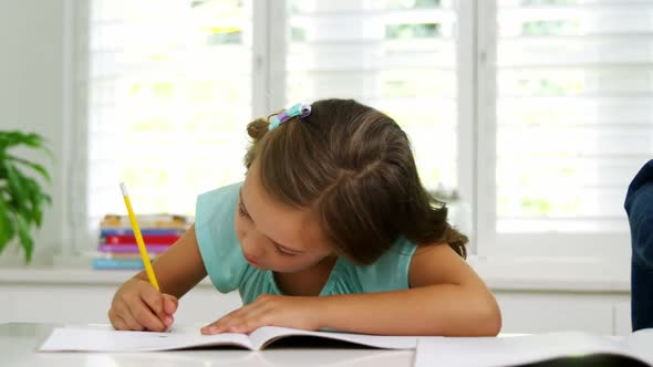 Two children doing homework together