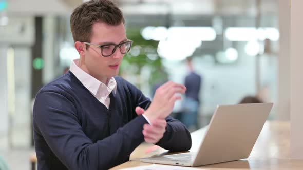 Young Businessman with Laptop Having Wrist Pain 