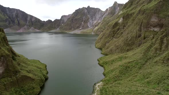 Aerial view of volcanic Lake Pinatubo and mountains, Porac, Philippines.