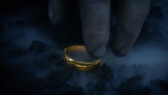 Glowing Gold Ring Is Picked Up From The Ground