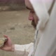 Jesus Or Biblical Man Picks Up Stone - VideoHive Item for Sale
