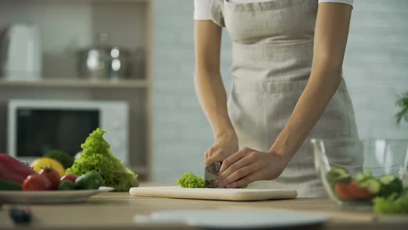 Girl Chopping Salad Leaf and Adding It Into Glass Bowl, Healthy Lifestyle, Diet