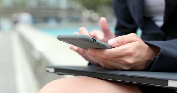 Businesswoman use cellphone at outdoor