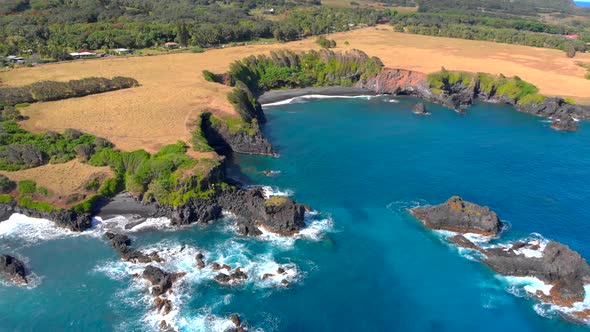 MUST SEE!!! Beautiful epic 4k Drone shot in Maui hidden private beach near to Hana. Black volcanic s