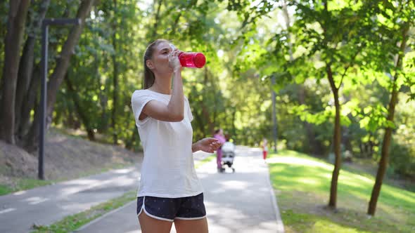 Woman Drink Water Red Bottle After Morning Workout