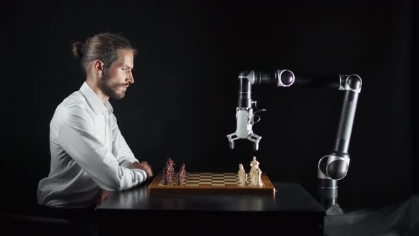 Modern Technology, Man Playing Chess with a Robot, the Confrontation Between Man and Artificial