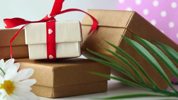 Many Gift Box and Flower on Table Close Up