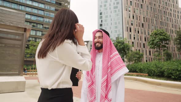 Arab Man Listening to Businesswoman