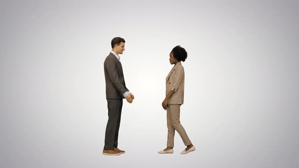 Business Man &amp; Woman Inmeet &amp; Shake Hands on Gradient Background.