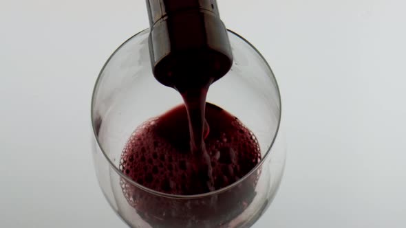 Bottle Filling Red Wine Goblet Closeup