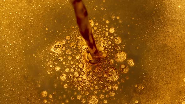 Top View of Light Beer Being Poured Into a Glass